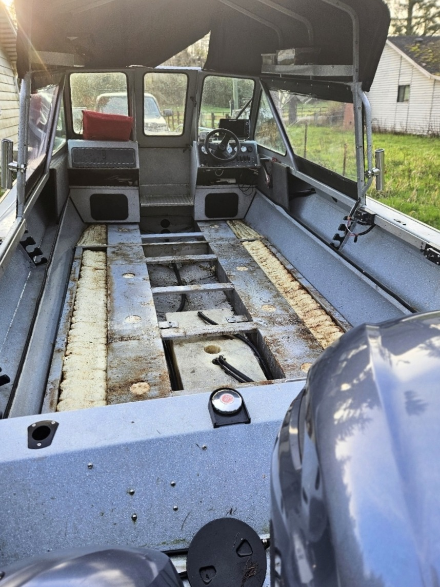 Fishing boat with floorboards removed after years of chasing salmon, ling cod, bottom fish, kokanee, trout, and more