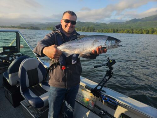 A happy client after early morning success on a Columbia River Spring Chinook Fishing Adventure