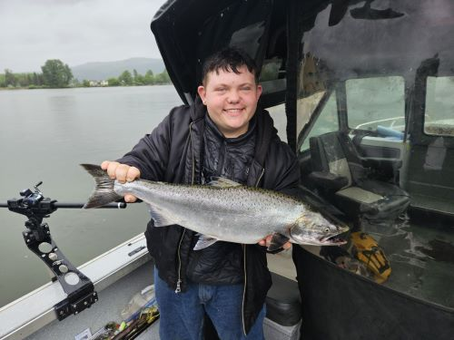 Bobby catching his first Spring Chinook on the Columbia River