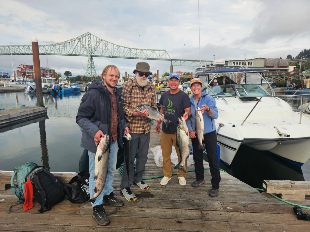 Another happy group showing of their Buoy 10 Salmon Charter catch!