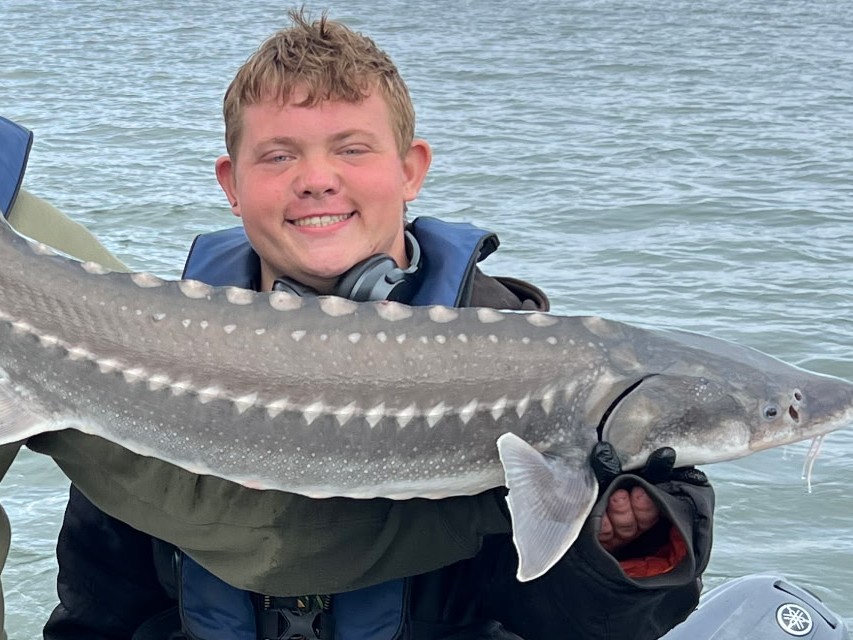 Bobby showing off his first ever Sturgeon caught near the Lewis and Clark National WIldlife Refuge.