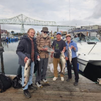 Another happy crew showing off their catch on a "Slow day" during Buoy 10 Salmon Fishing in Astoria, Oregon